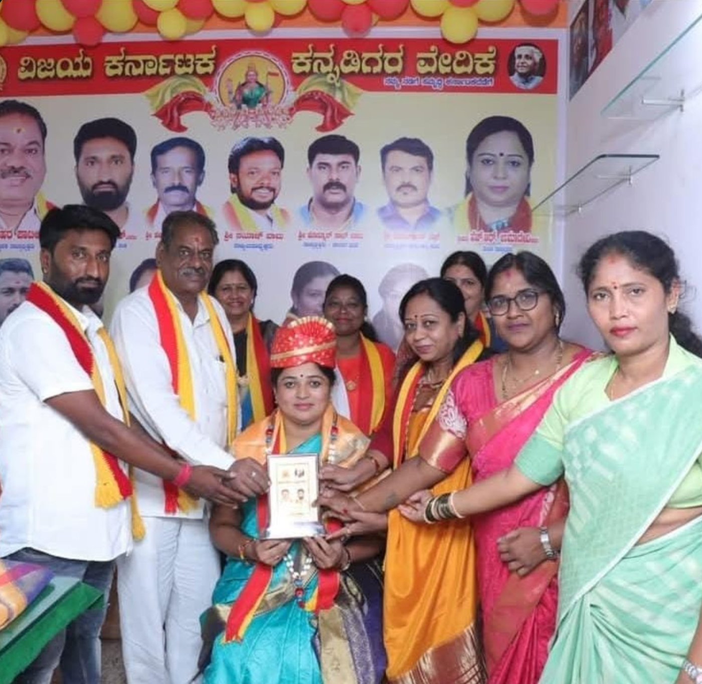 A woman being felicitated with a certificate at a Foundation event